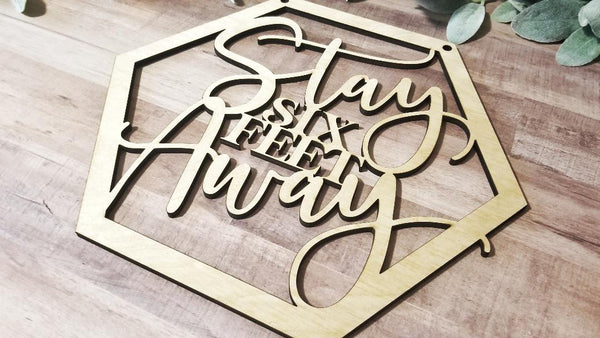 Stay 6 feet away sign